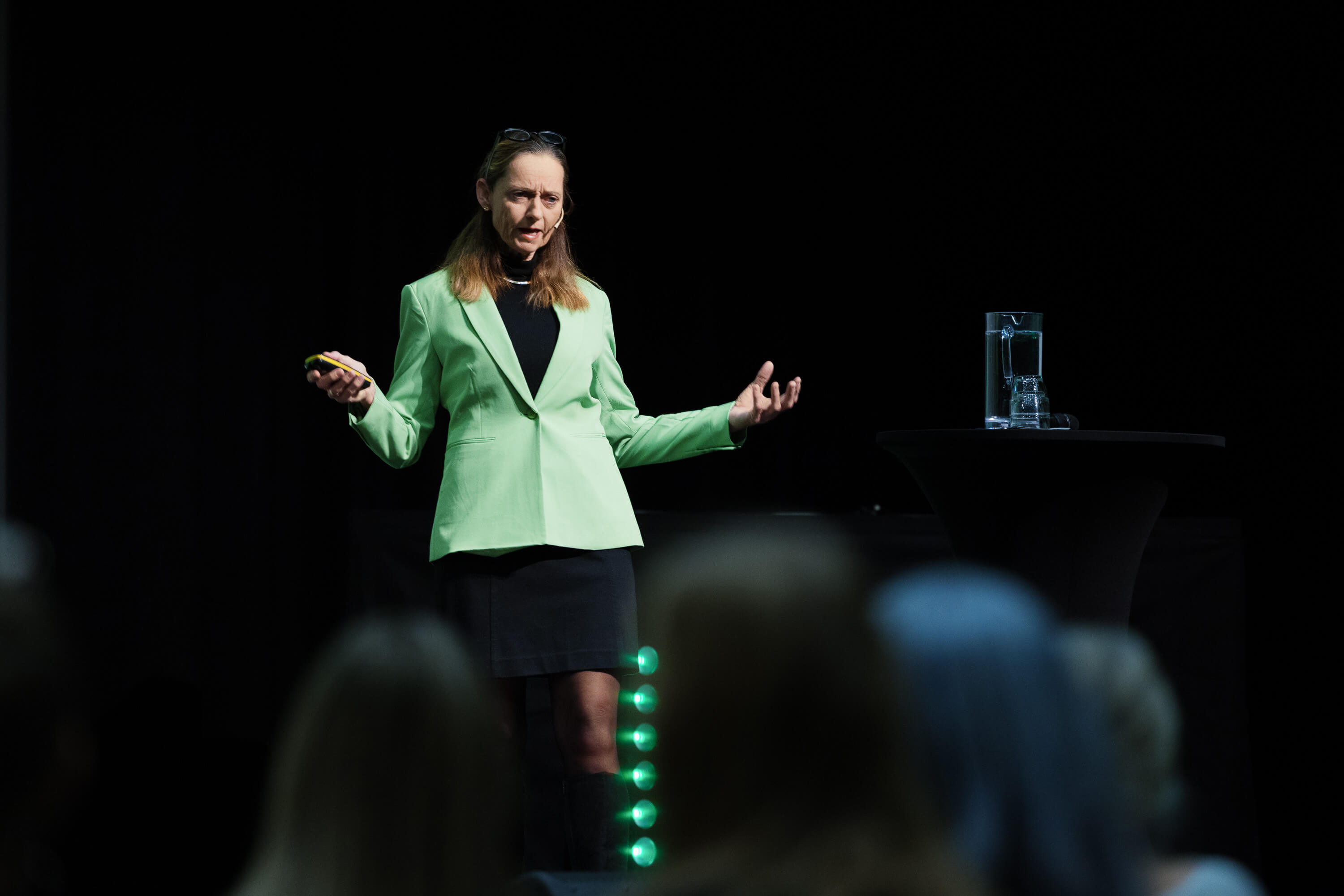 CEO Torhill Gysland Falnes presenting on stage