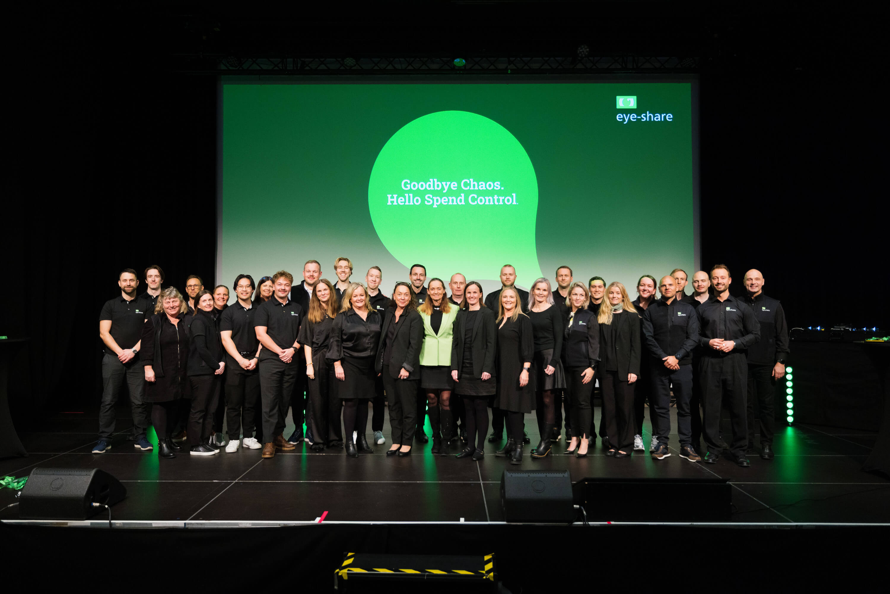 Group picture of eye-share employees on stage at eye-share User Conference 2025