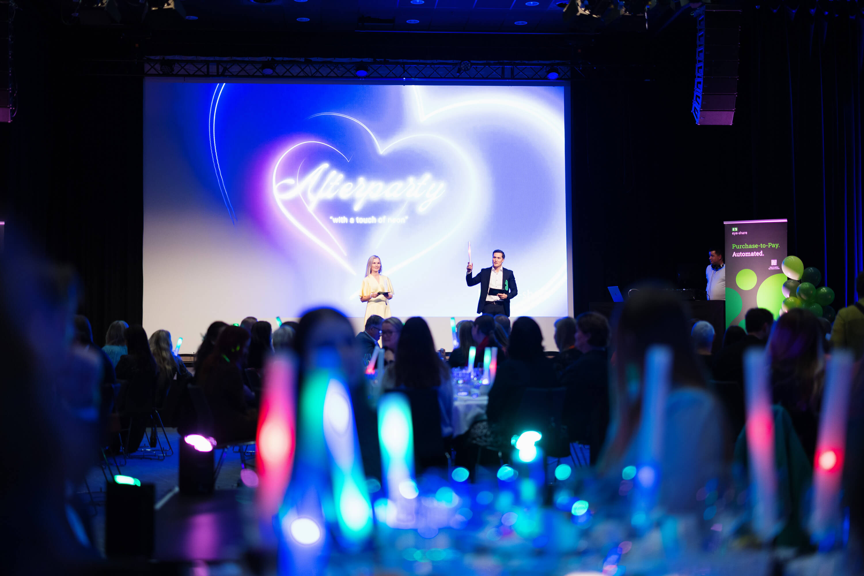 Kristine Maudal and Jan Eric Gløpstad on stage at afterparty eye-share user Conference 2025