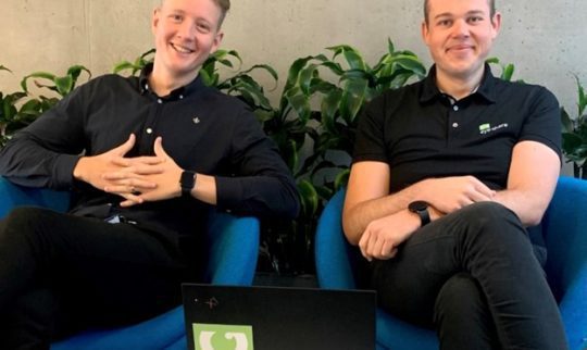 Martin Ulland and Mats Danielsen sitting behind a table with a laptop.
