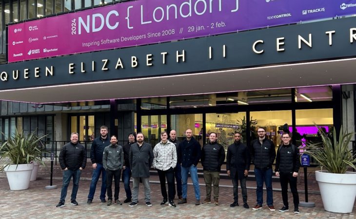 Showing the Eye-share software developer team in front of the conference arena at NDC London 2024