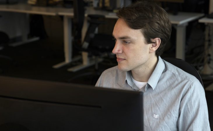 Eye-share employee working in front of computer.